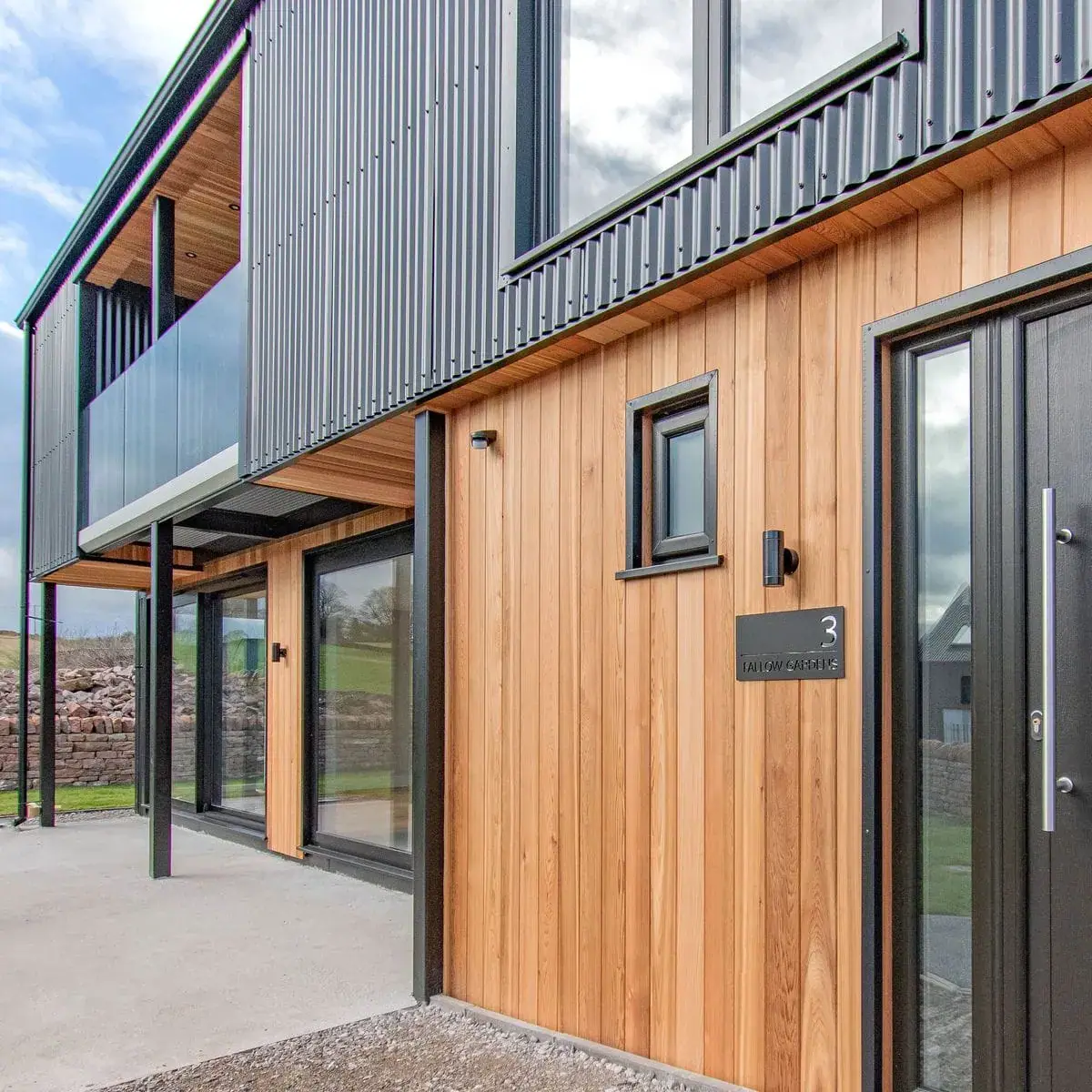 House exterior with wood and metal wall cladding